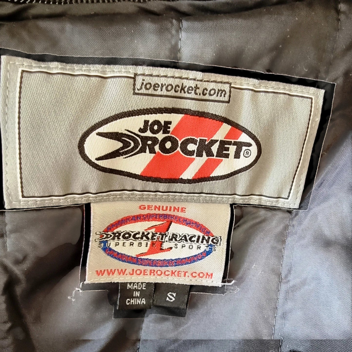 Timelessfashions Honda Joe Rocket women's black motorbike jacket with adjustable straps, thermal liner, and protective padding. Size S.