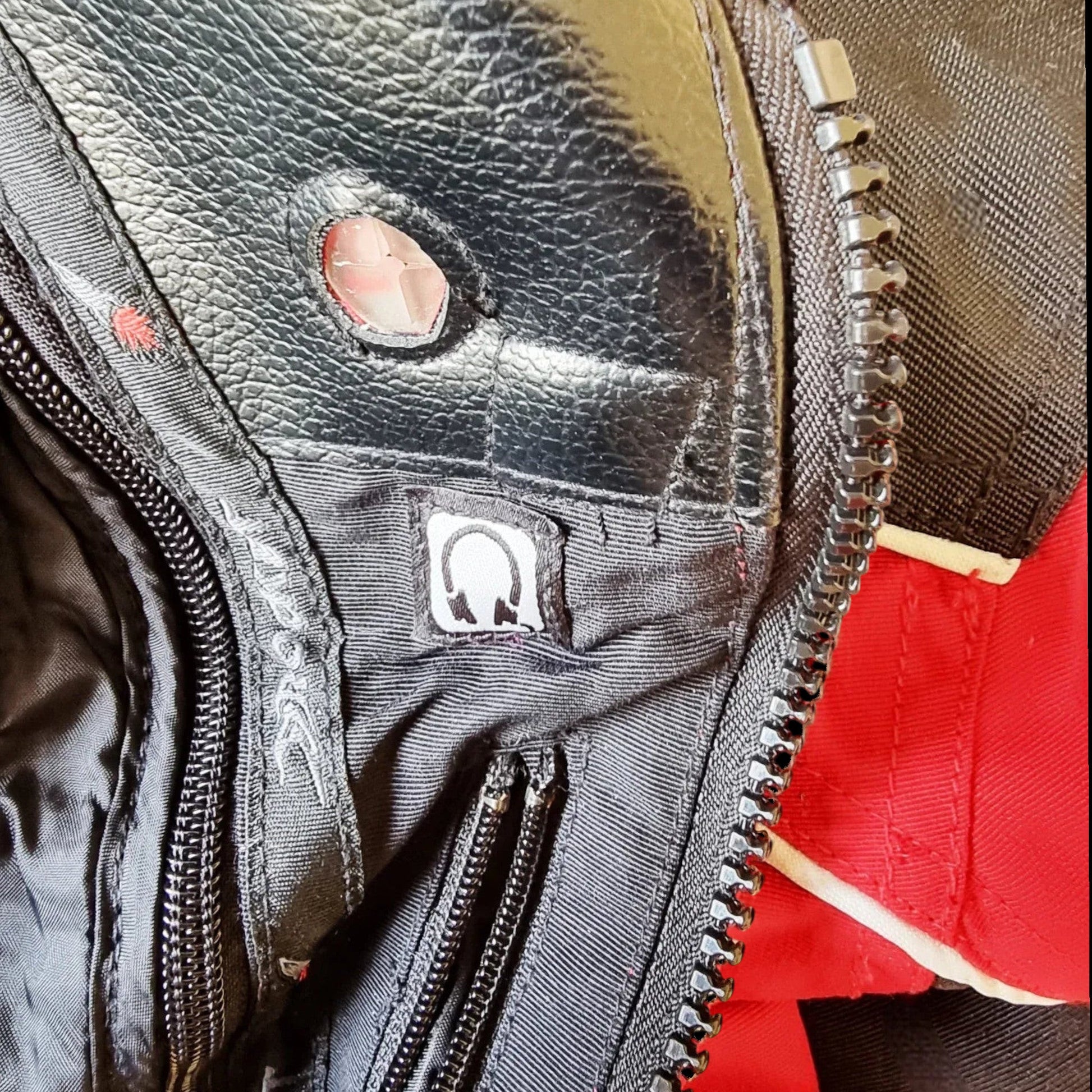 Timelessfashions Honda Joe Rocket women's black and red motorbike jacket with adjustable straps, protective padding, and zippered pockets.