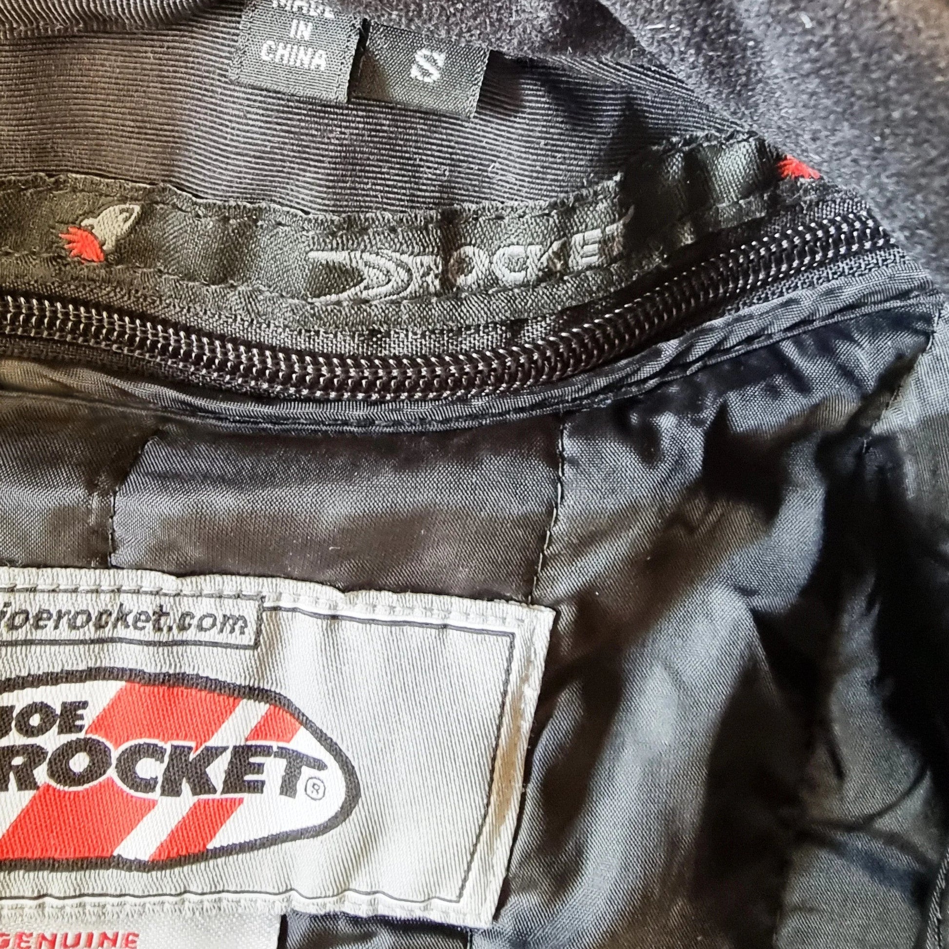 Timelessfashions Honda Joe Rocket rare women's black motorbike jacket with adjustable straps, protective padding, and removable liner. Size S.