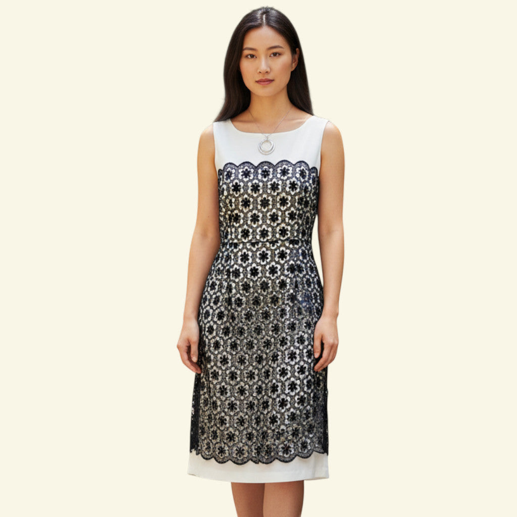 Timelessfashions navy and white floral lace sheath dress with a scalloped hem. 100% cotton.