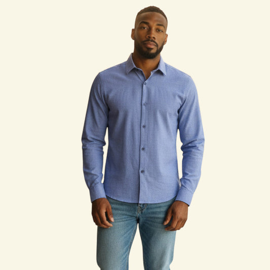 Tommy Hilfiger men's mid blue 100% cotton chambray long sleeve button-down shirt with stitch detail and branded flag on cuff.