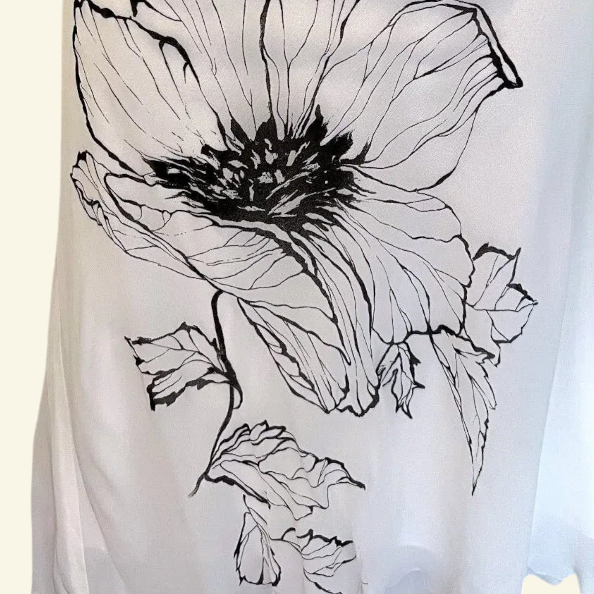Timelessfashions white chiffon skirt with black floral print, side zip, UK 14.