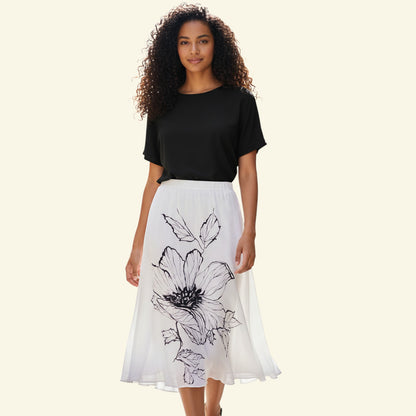 Timelessfashions white chiffon skirt with black floral print, side zip, size UK 14.