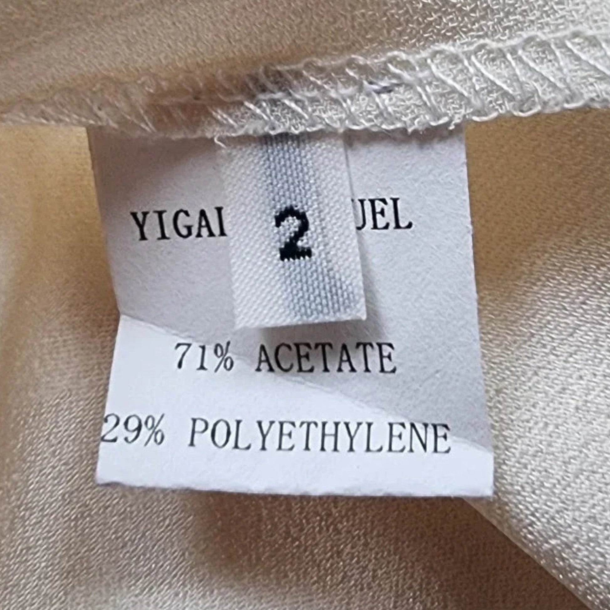 Timelessfashions Yigal Azrouel black and cream crossover ruched pencil dress, size US 2, made from acetate and polyethylene.