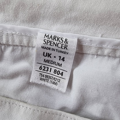 Marks & Spencer label on a white garment with text details.