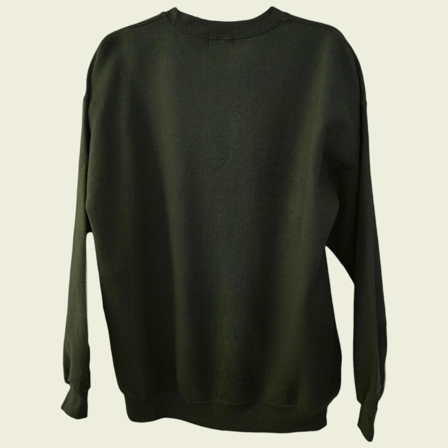Dark green sweatshirt on a beige background