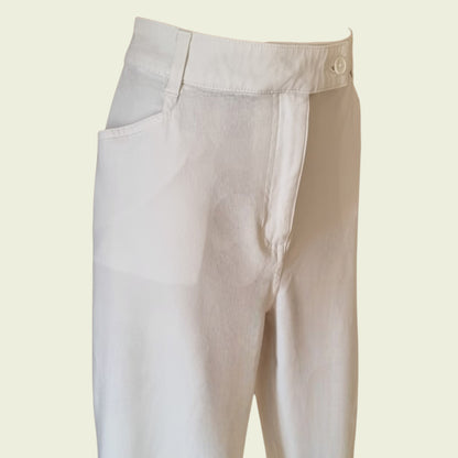 White jeans pants on a beige background