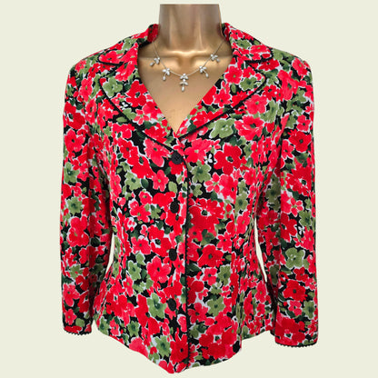 Floral patterned jacket on a mannequin against a plain background