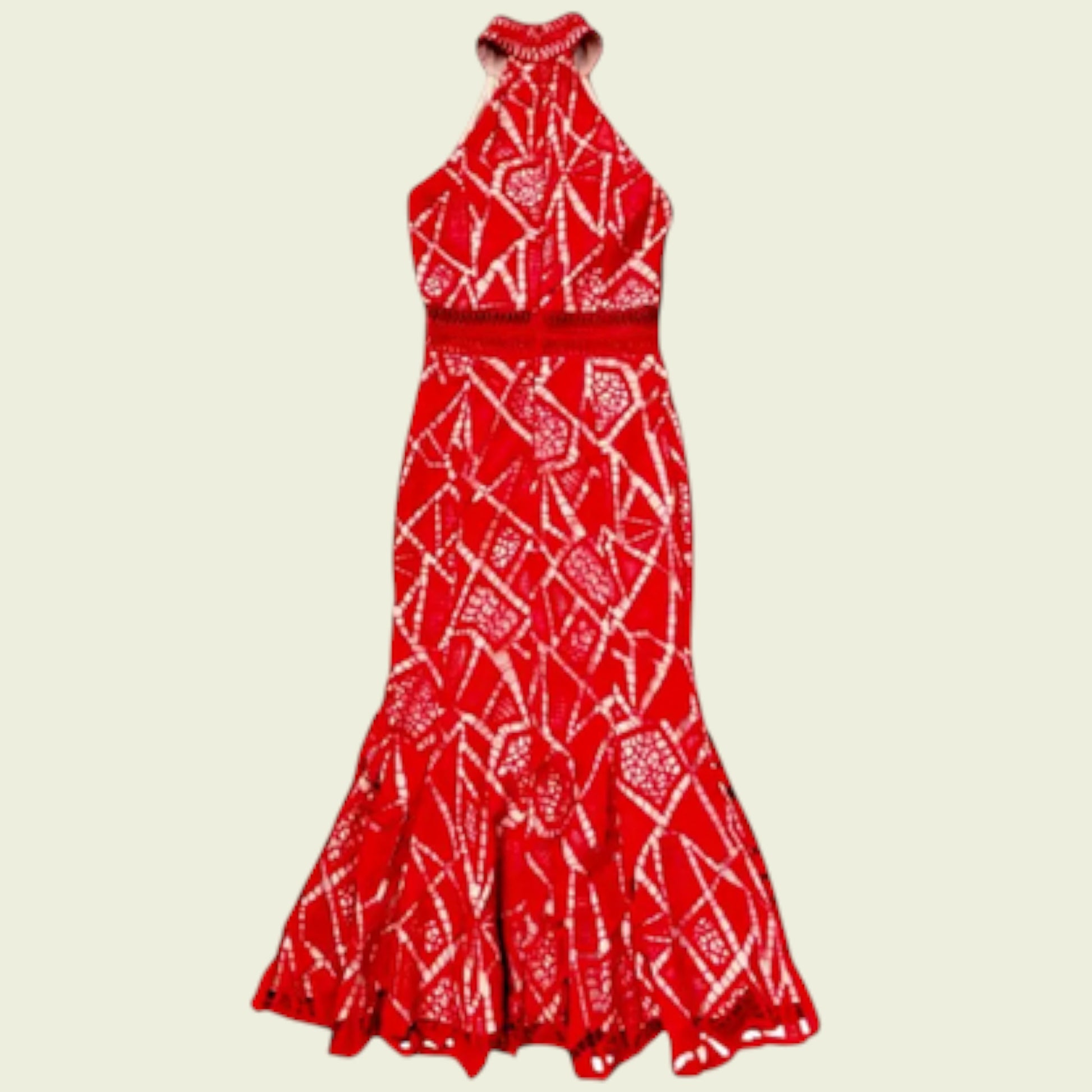 Red and white patterned halter neck dress on a beige background