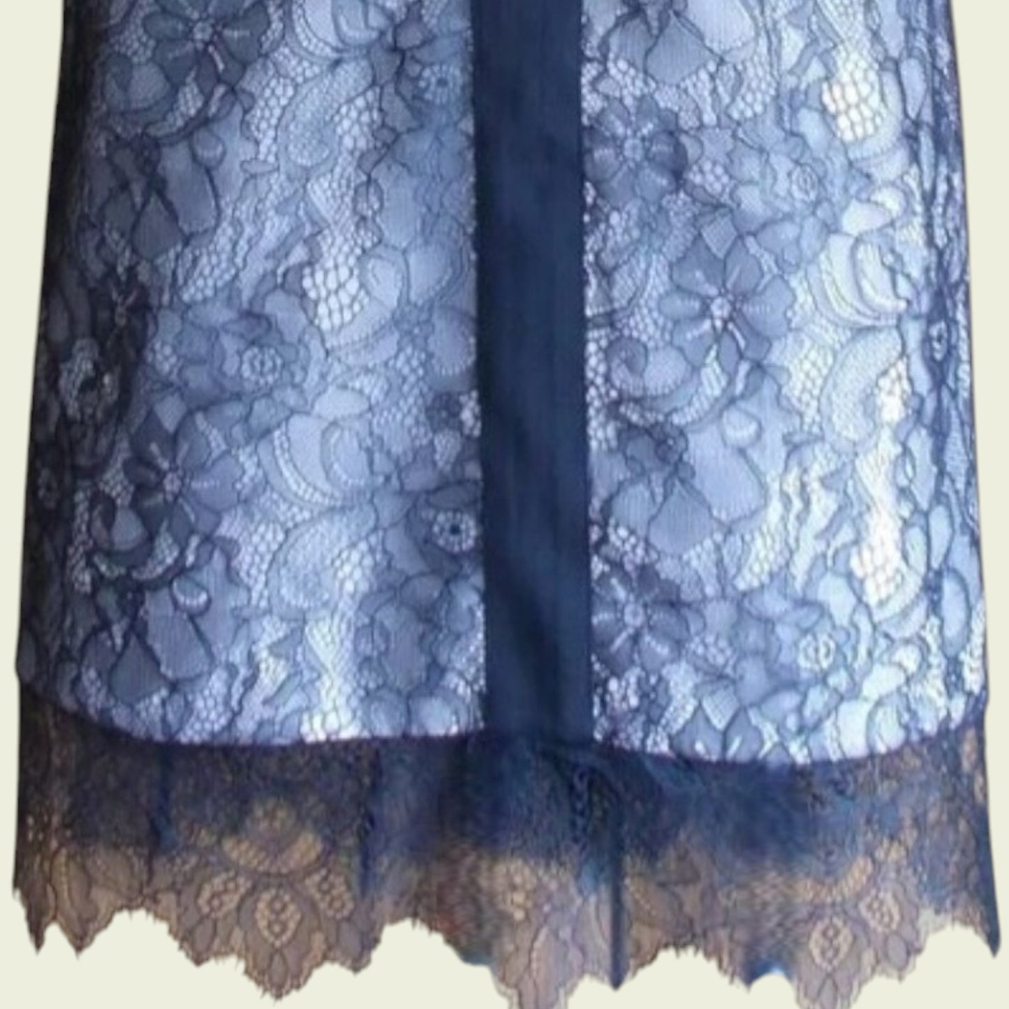 Black lace fabric on a white background