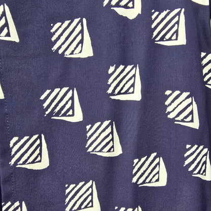Navy blue fabric with white geometric triangle pattern