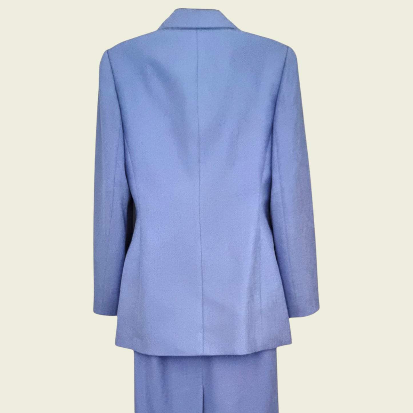 Light blue suit jacket on a beige background