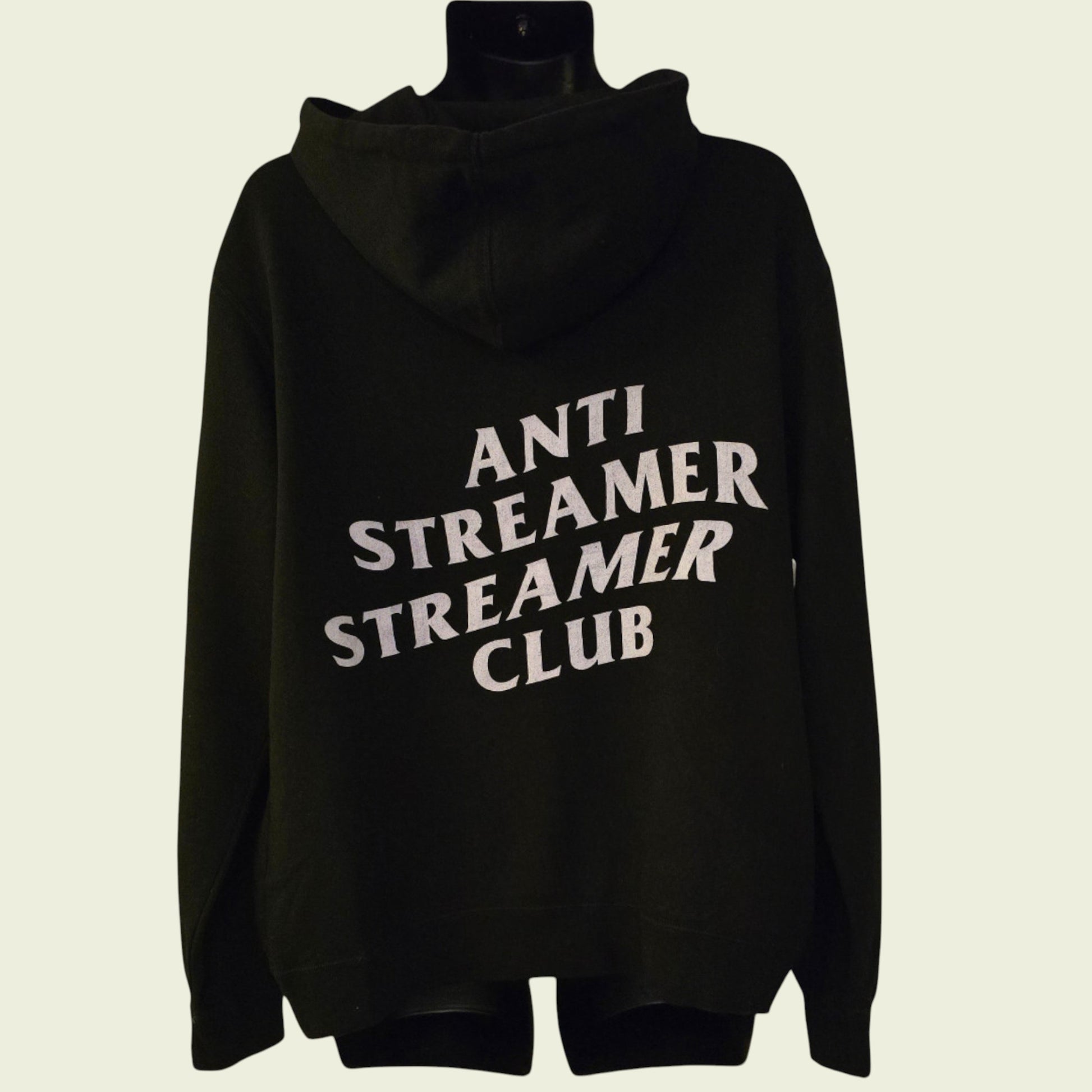 Black hoodie with 'ANTI STREAMER STREAMER CLUB' text on a beige background