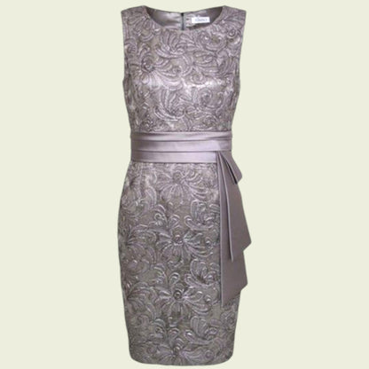 Silver floral-patterned dress with a belt on a light beige background