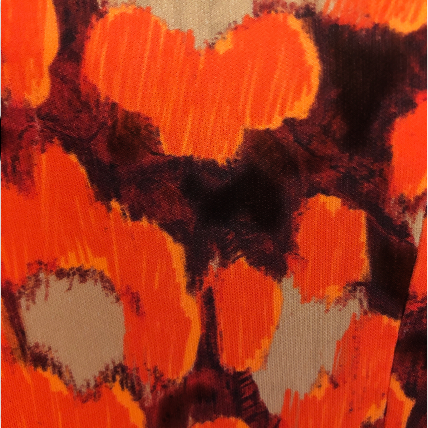 Swatch showing orange, black and beige colours