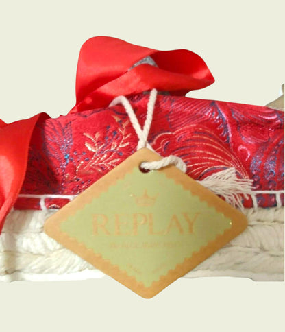 Red fabric with a bow and 'Replay' tag on a white background