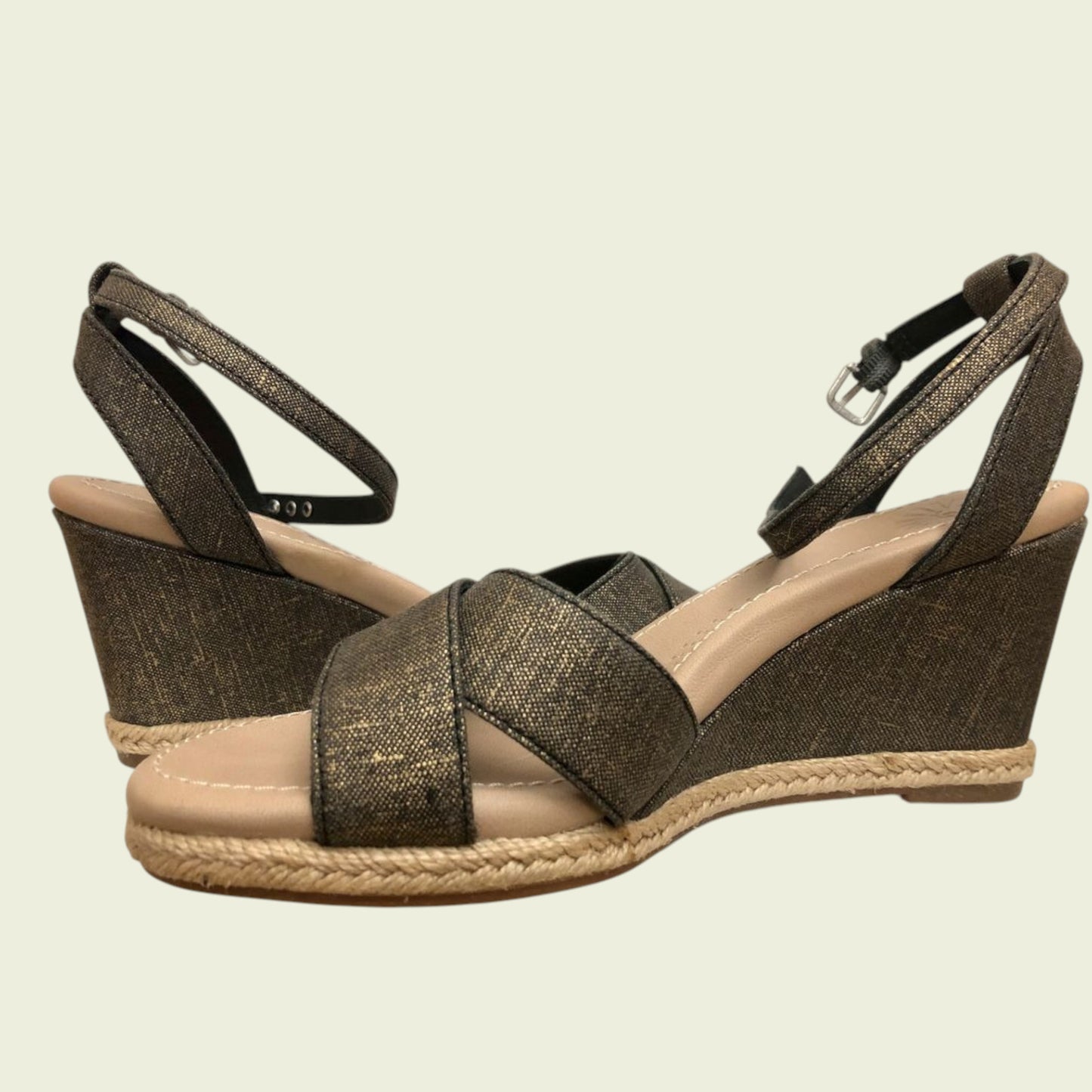 Brown wedge sandals with jute sole on a beige background
