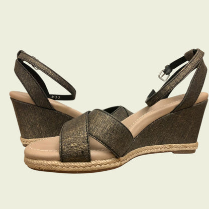 Brown wedge sandals with jute sole on a beige background