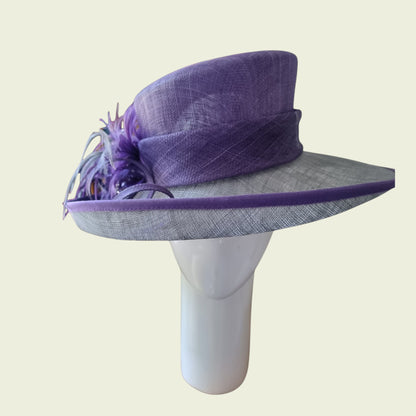 Side view of mauve hat on beige background