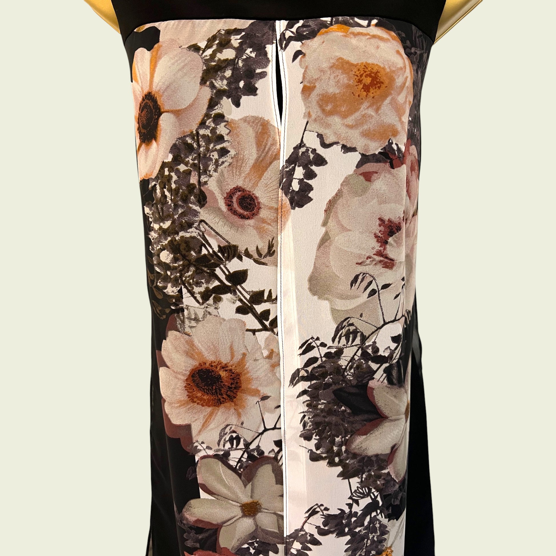 Floral patterned dress on a beige background