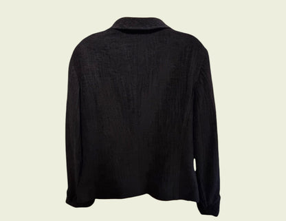 Black long-sleeve jacket on a beige background