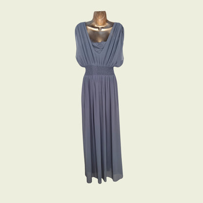 Blue dress on a mannequin against a beige background