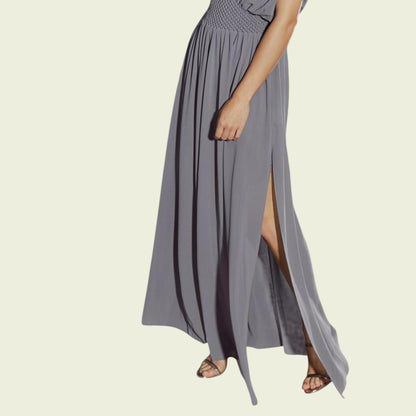Gray maxi dress with a slit on a beige background