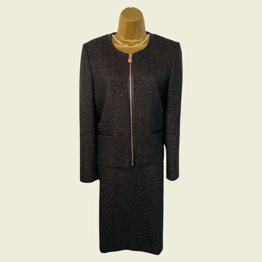 Navy suit on a mannequin against a beige background