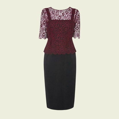 Black dress with lace sleeves on a beige background