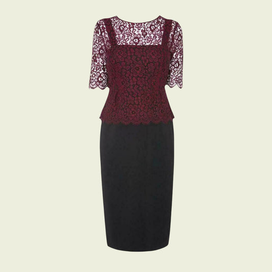 Black dress with lace sleeves on a beige background