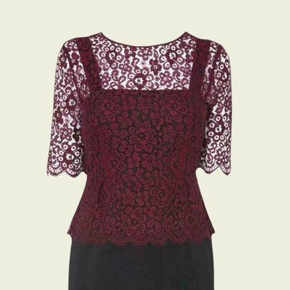 Red lace top with floral sleeves on a beige background
