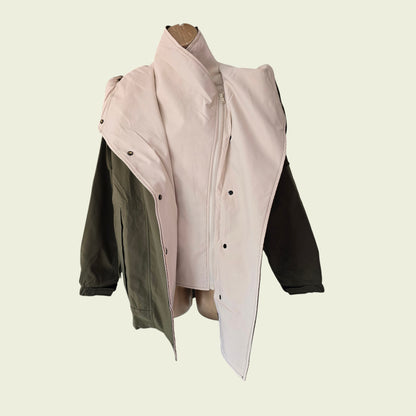 Khaki rain coat showing internal jacket on beige background