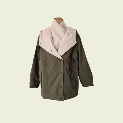 Khaki rain coat showing internal jacket on beige background