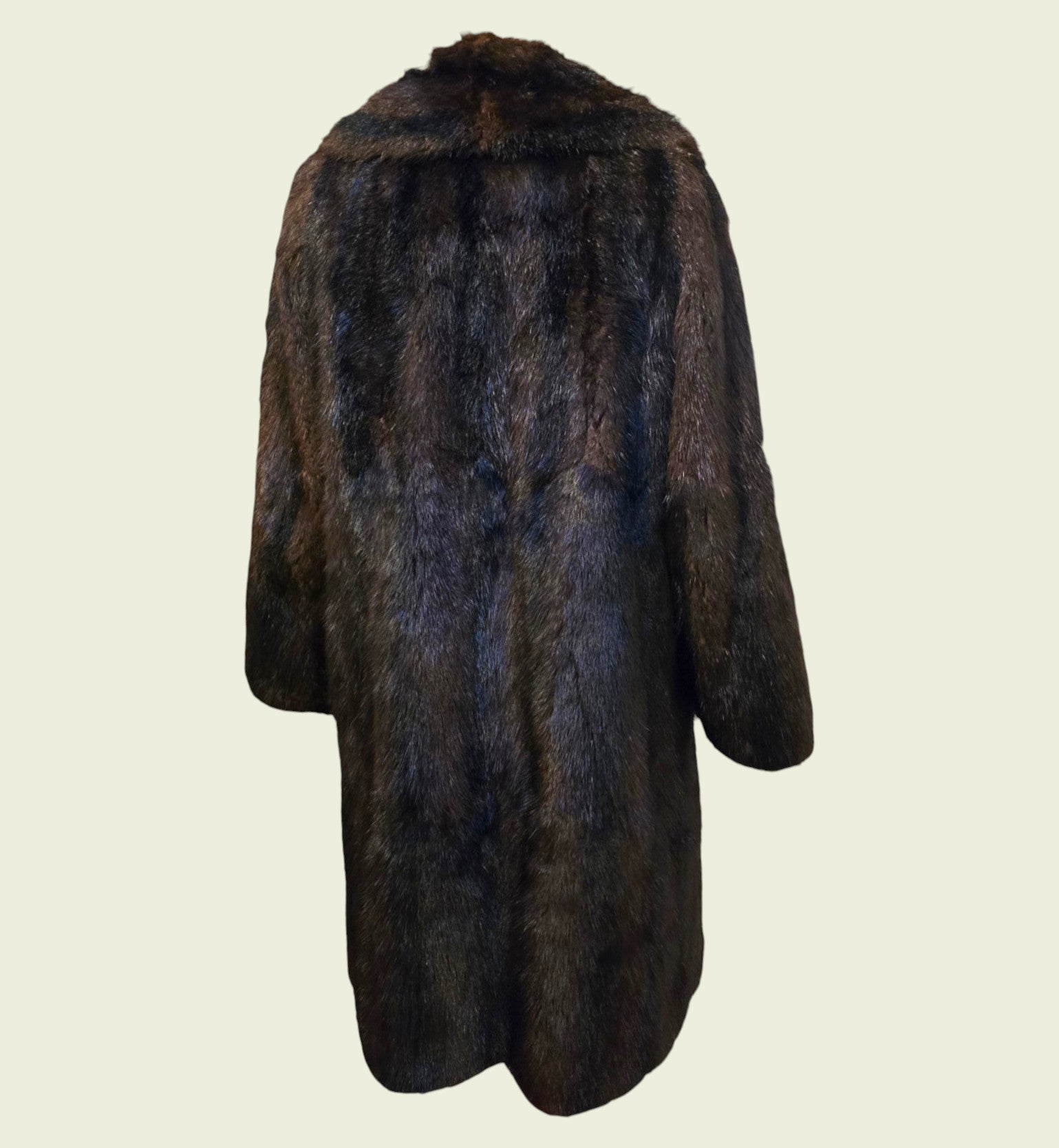 Dark brown fur coat on a light beige background