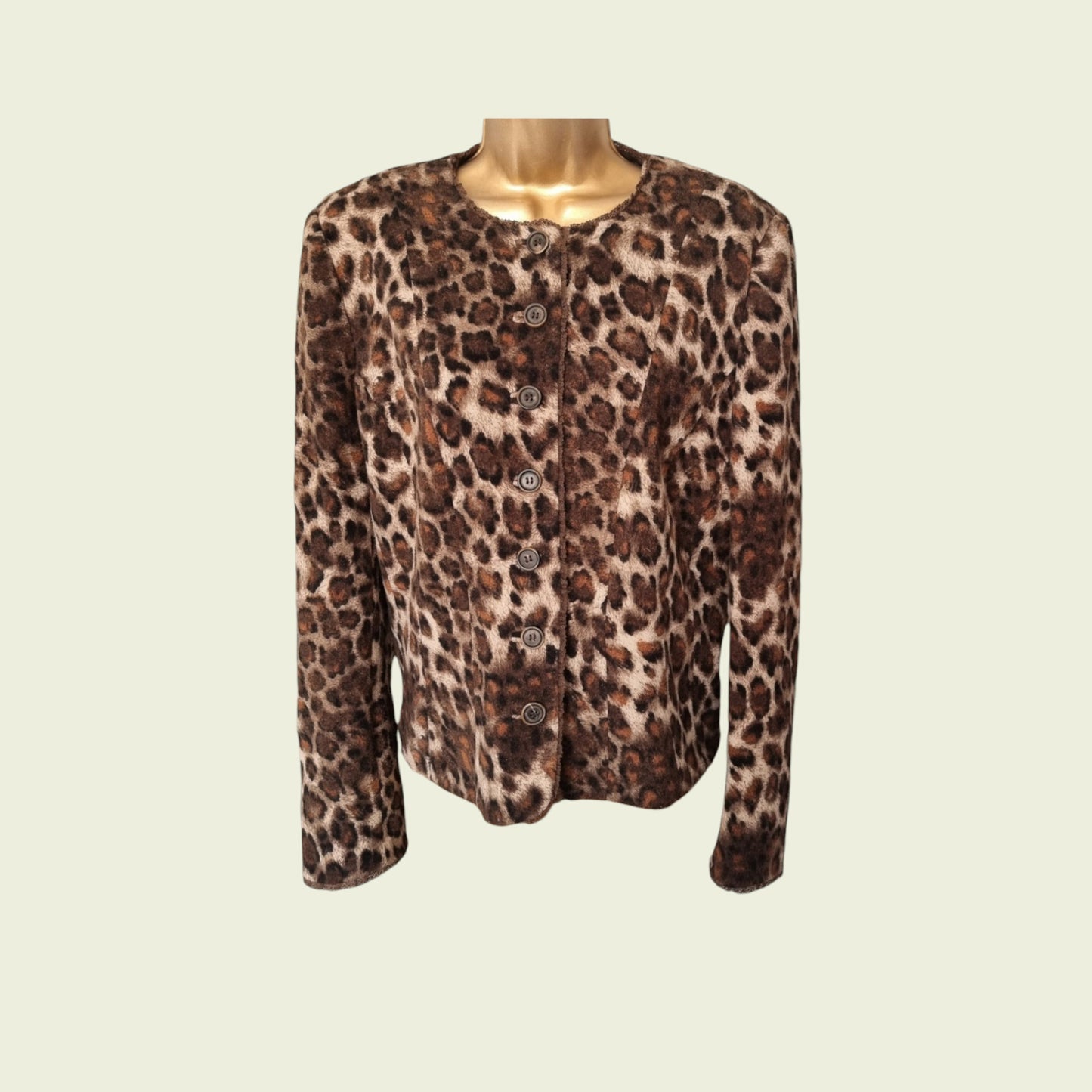 Leopard print jacket on a mannequin against a beige background