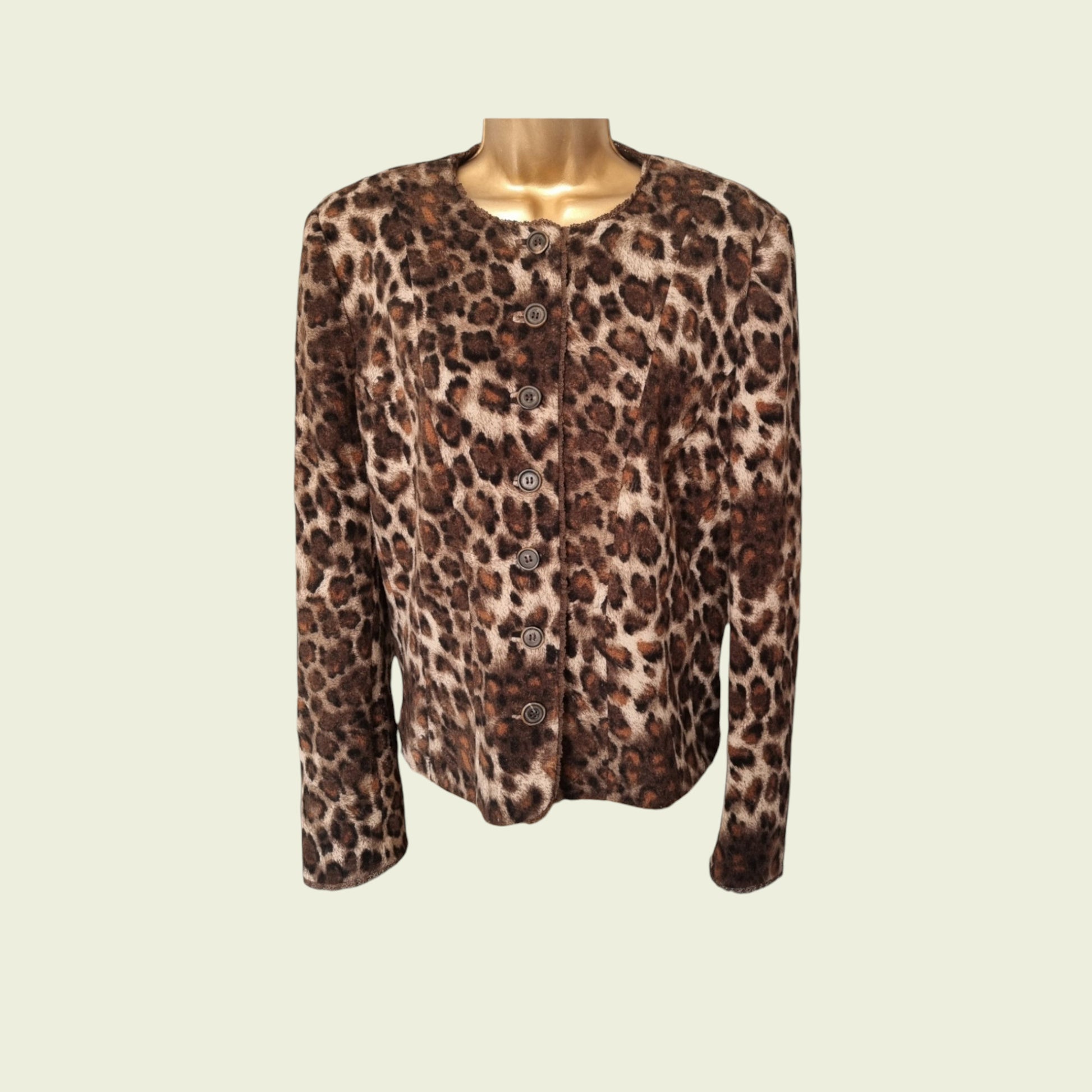 Leopard print jacket on a mannequin against a beige background
