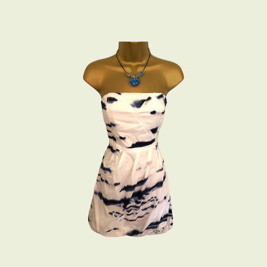 Striped dress on a mannequin with a plain background
