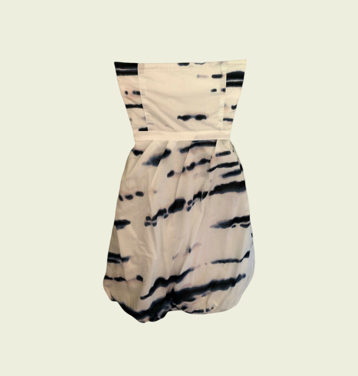 Beige and black tie-dye strapless romper on a beige background