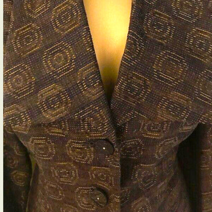 Close-up of a plum patterned blazer with a blurred background