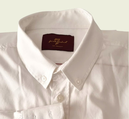 Men's white dress shirt on beige background