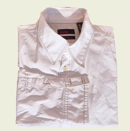 Men's white pleated dress shirt on beige background