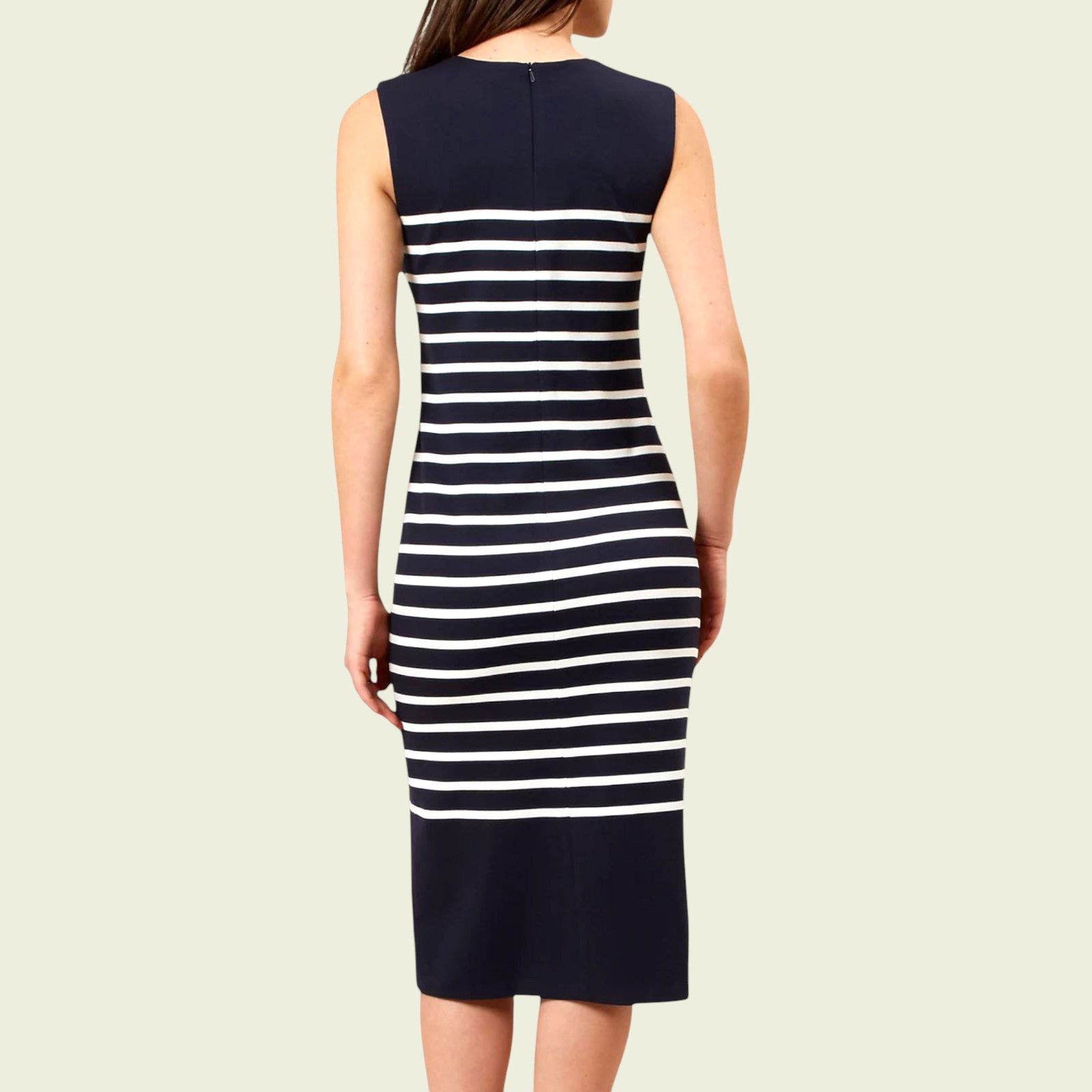Navy and white striped dress on a plain background