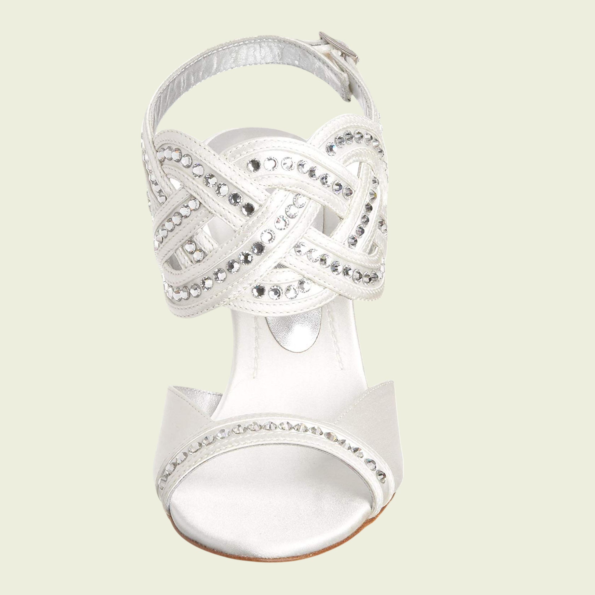 Silver high-heeled sandal with intricate design on a light beige background
