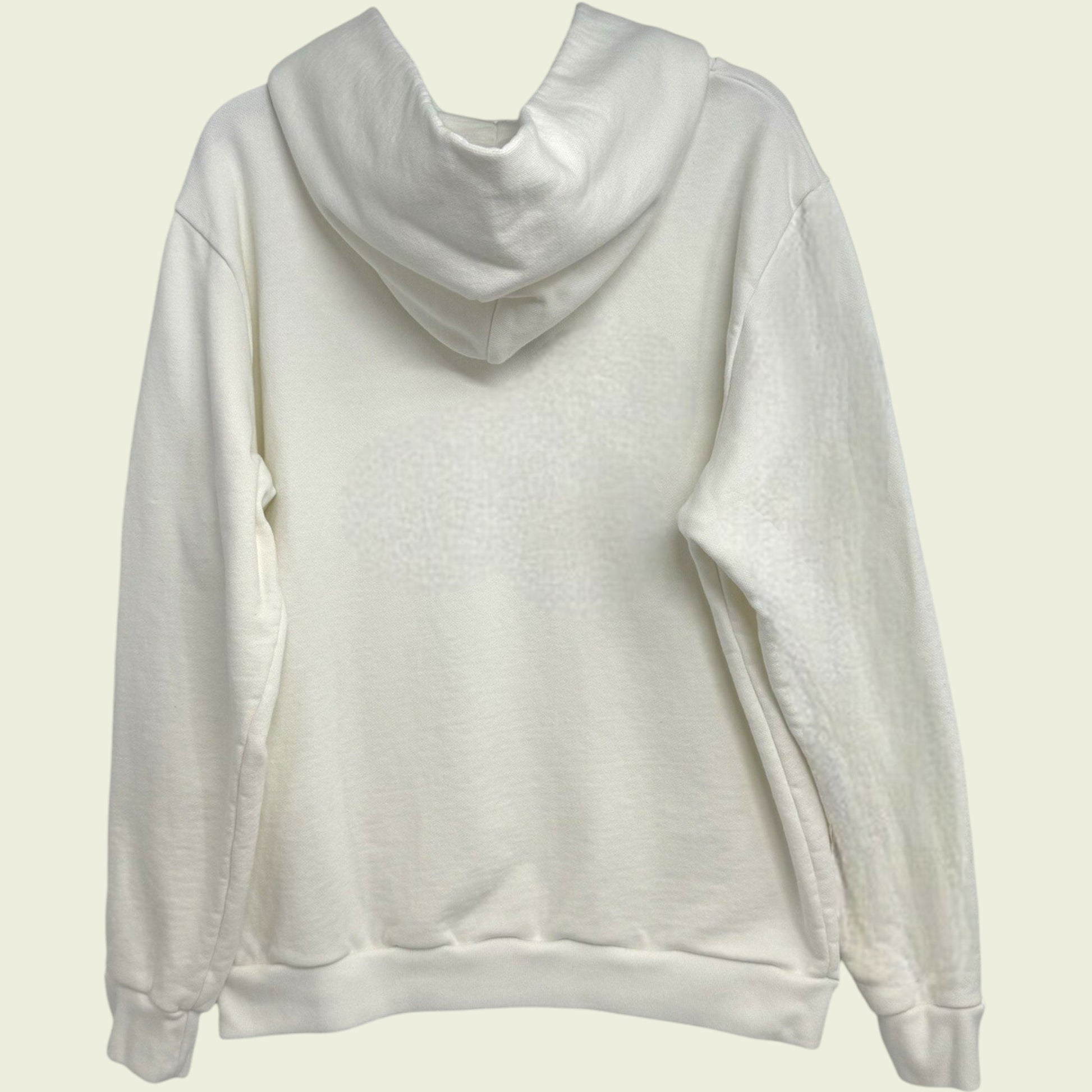 White hoodie on a light beige background