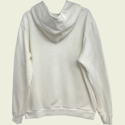 White hoodie on a light beige background
