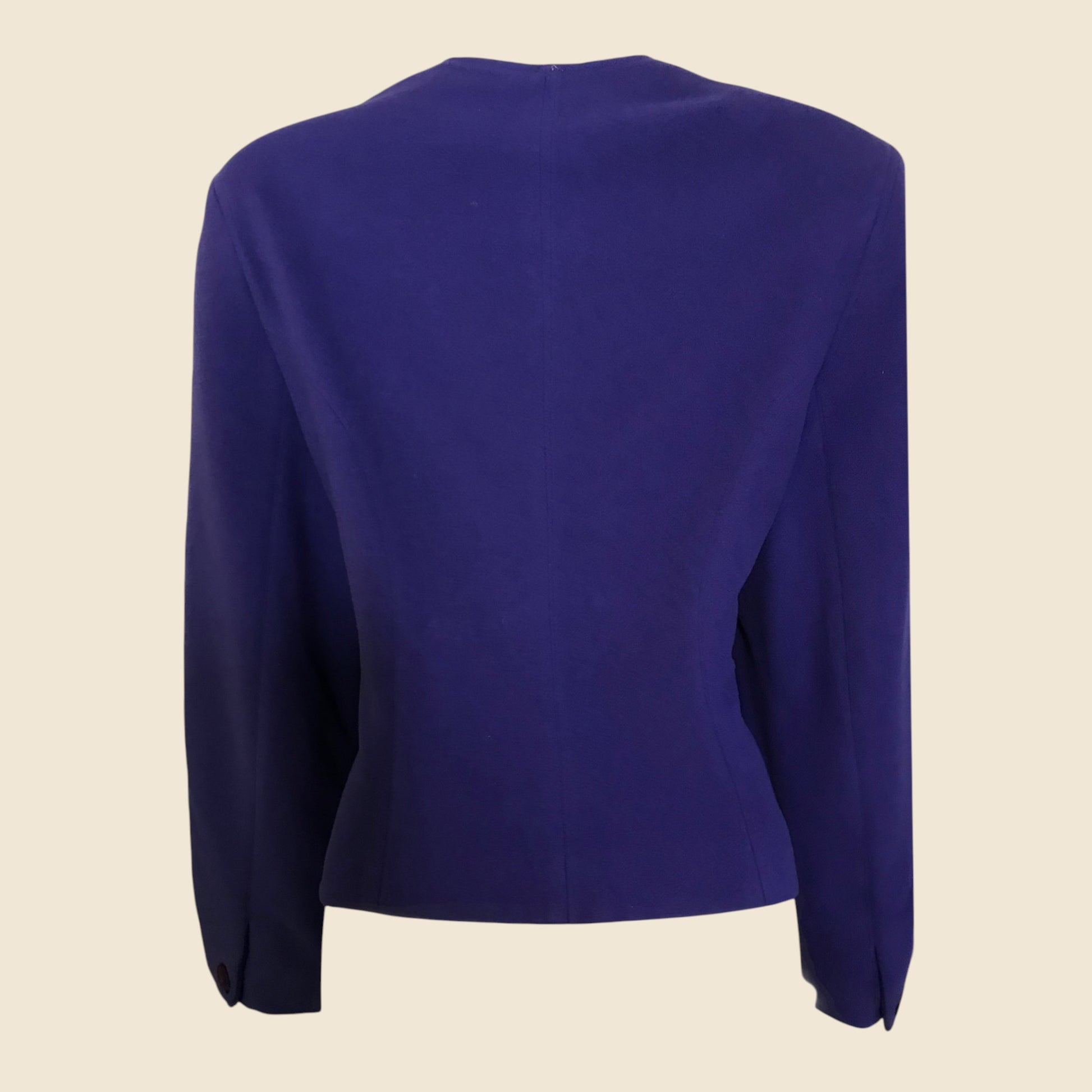 Purple jacket with long sleeves on a beige background