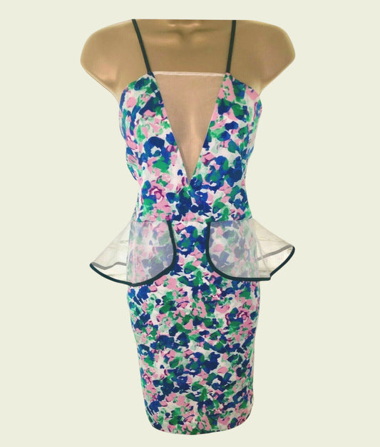 Floral dress with a peplum waist on a mannequin against a beige background