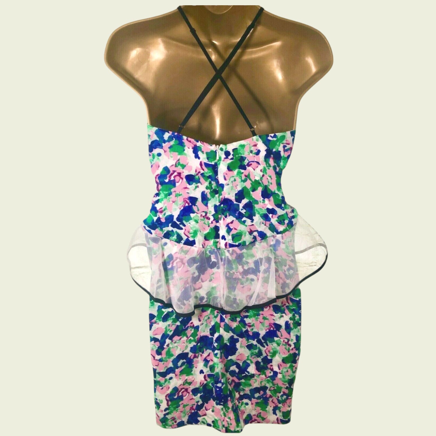 Floral dress on a mannequin with a white background
