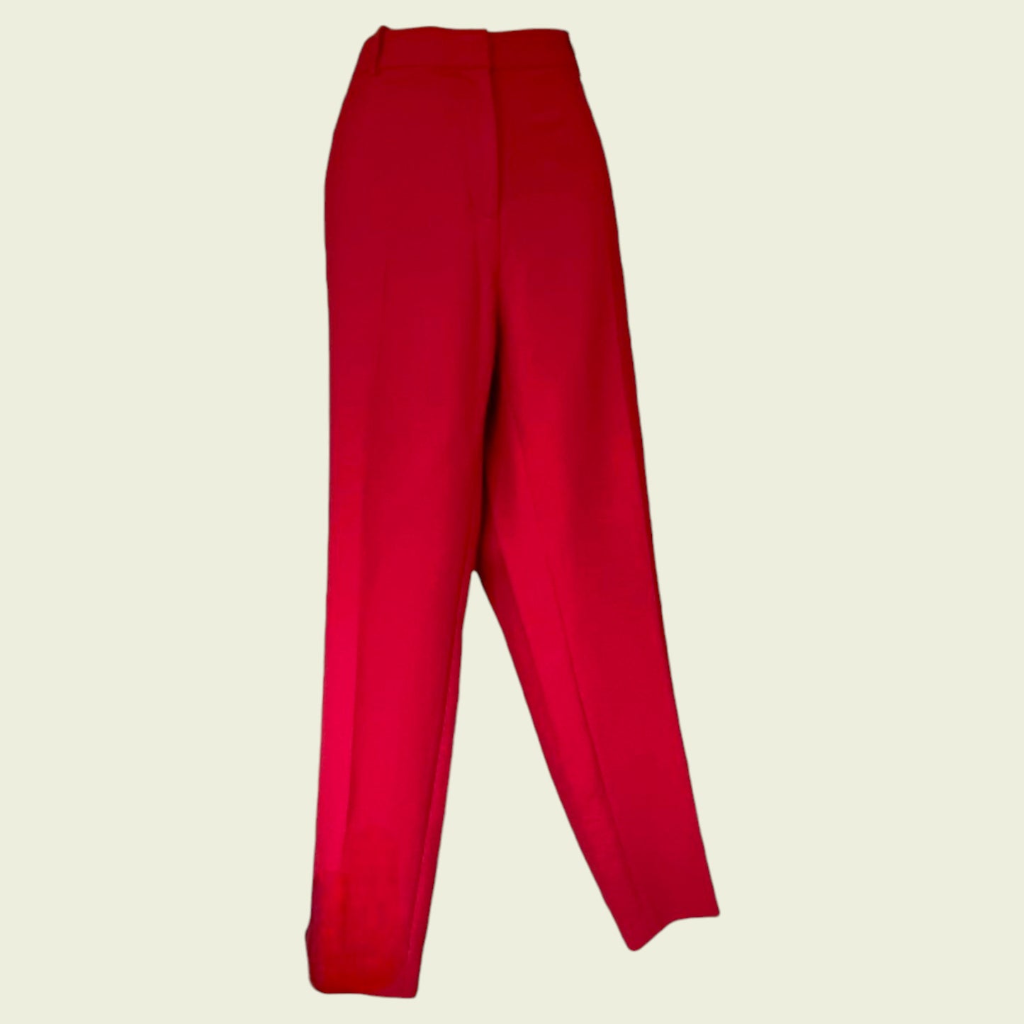 Red pants on a beige background