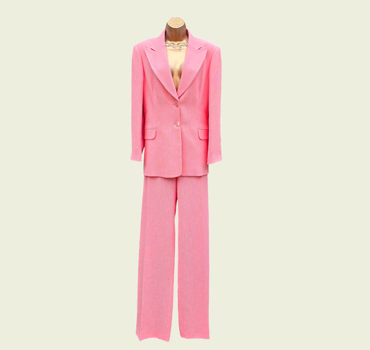 Pink suit on a mannequin against a beige background